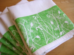 Close up of lino printed tea towels