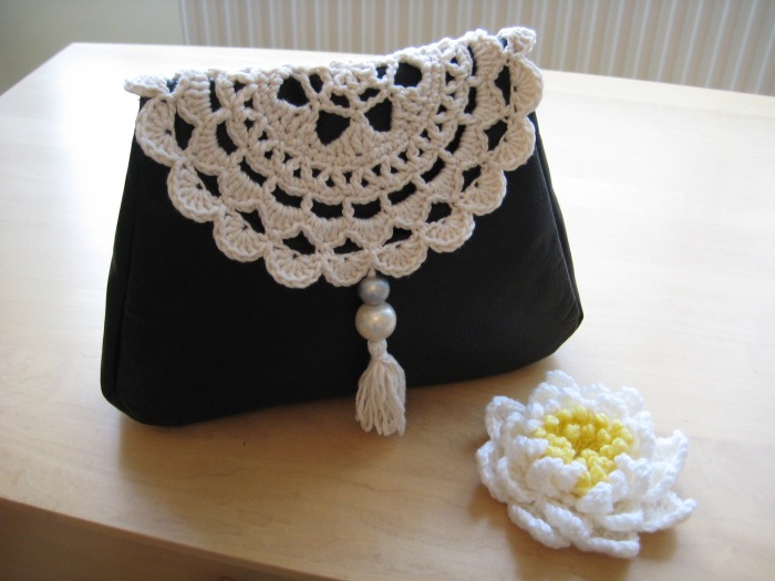 Doily flap on leather clutch bag :)
